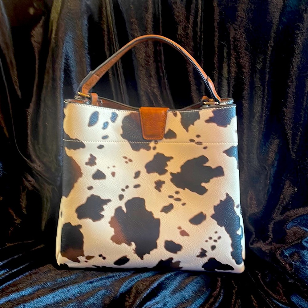 Tote comes with adjustable shoulder strap. 11W X 10H X 4D.